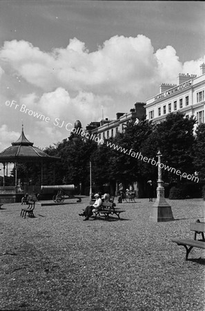 HOTEL COMMODORE ON DAY OF OPENING WITH BANDSTAND AND PARK